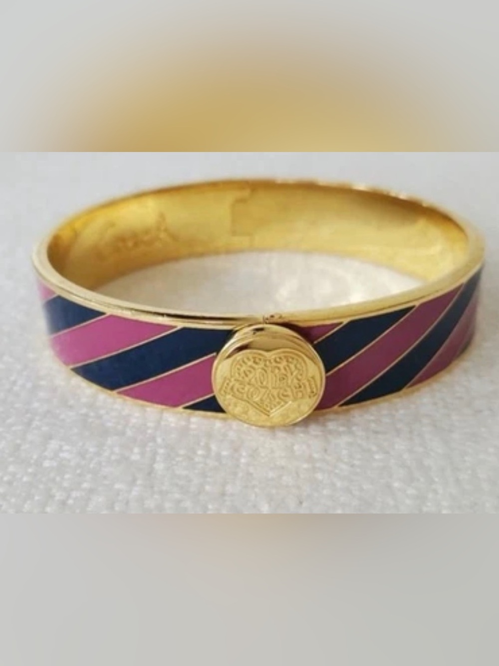 Coach Poppy Gold Tone Bangle Bracelet with Heart Hinge Closure